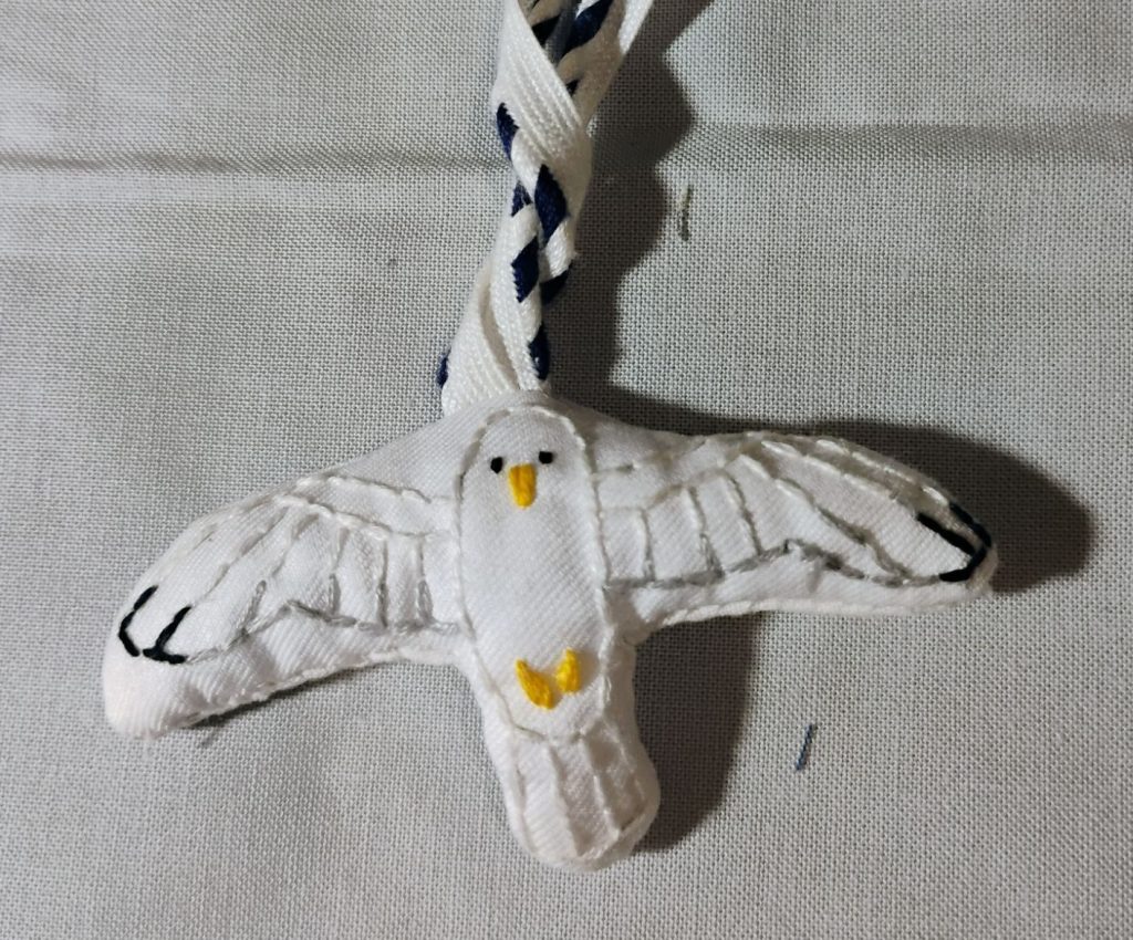An embroidered ornament of a seagull